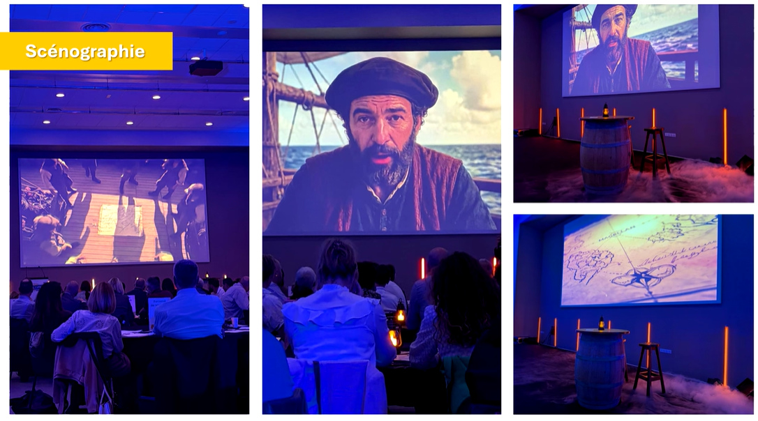 Cas client : une convention avec un personnage IA d'explorateur projeté sur écran géant, entouré d'une scénographie avec tonneaux, lumières chaudes et mapping vidéo.
